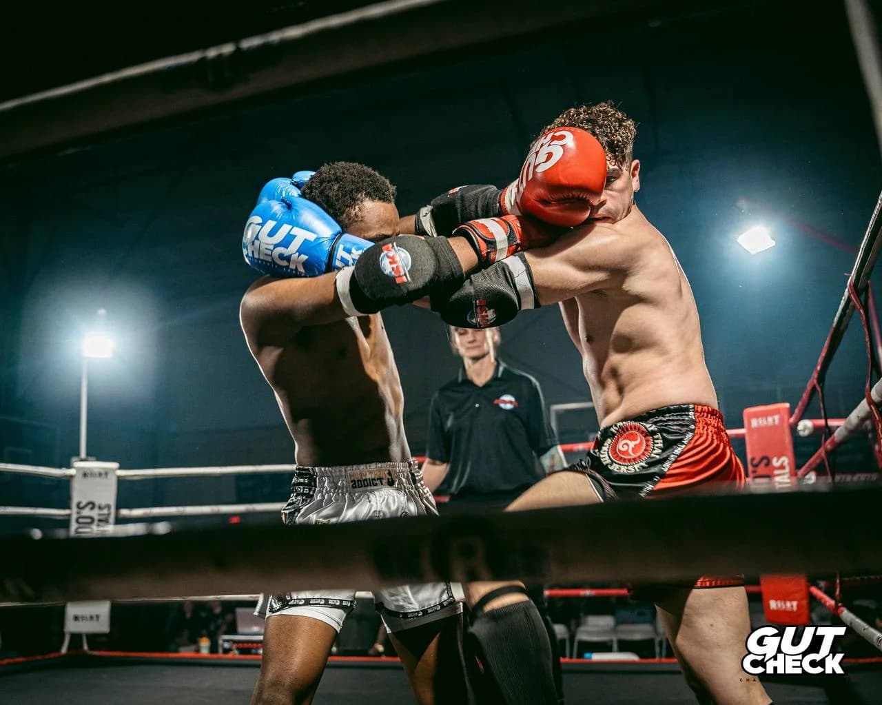 Two fighters locked in a fierce battle at Gut Check Championship Series, a premier Muay Thai competition near Philadelphia.